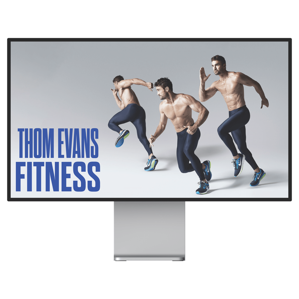Monitor screen showcasing the website for Thom Evans Fitness.